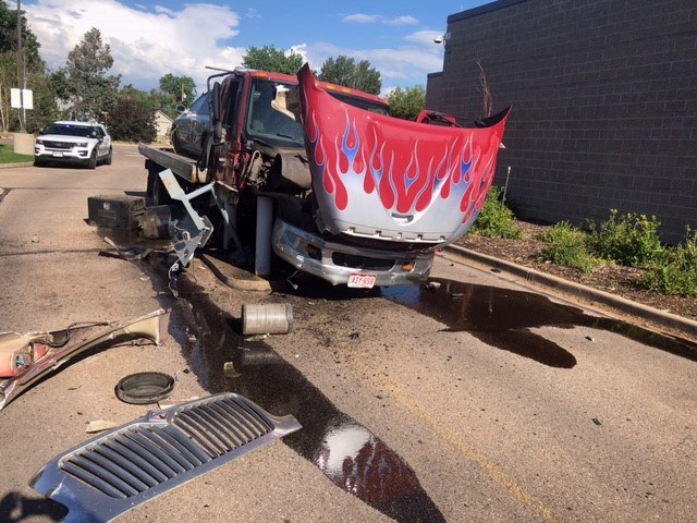 Tow truck crashed into concrete poles outside Greeley Police Station on Monday, June 28, 2021