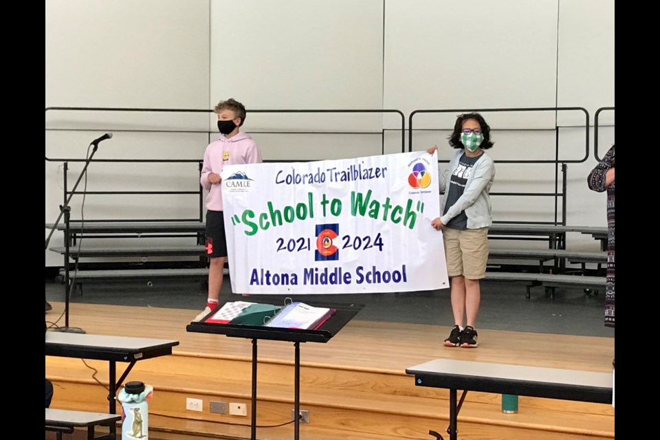 Altona Middle School's seventh grade students, Ben Barnett and Brynn Rothstein, on stage during the banner ceremony announcing the school's designation as a 2021 Colorado Trailblazer Schools to Watch on May 13, 2021 | Photo by Silvia Solis 