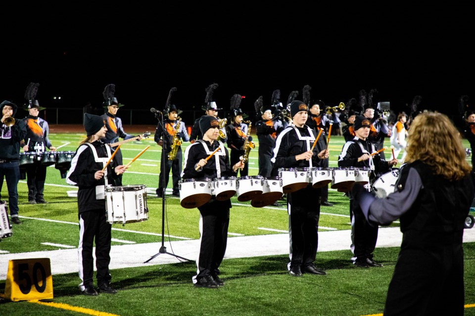 Mead High School's Unified Percussion Ensemble took the field at half-time to play with Guerilla Fanfare Brass Band and the Mavericks Marching Band Friday night.