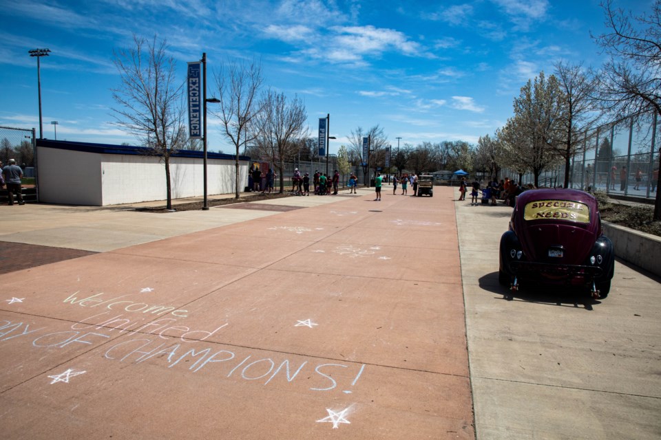 Messages of welcoming and encouragement in chalk on the pavement at Longmont High School