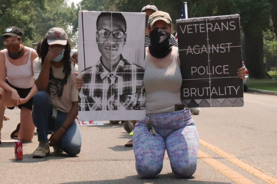 Demonstrators knelt in silence for 2 minutes in honor and memory of those impacted by racial injustice during Saturday's Longmont 4 Racial Justice Protest.
(Photo by Samantha Stanley)