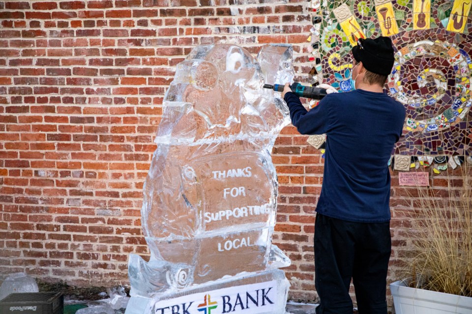 Jess Parish of Cool Hand Ice carves a 1,200-pound groundhog sculpture at St. Stephen's Plaza in Longmont on Tuesday, Feb. 2, 2021.