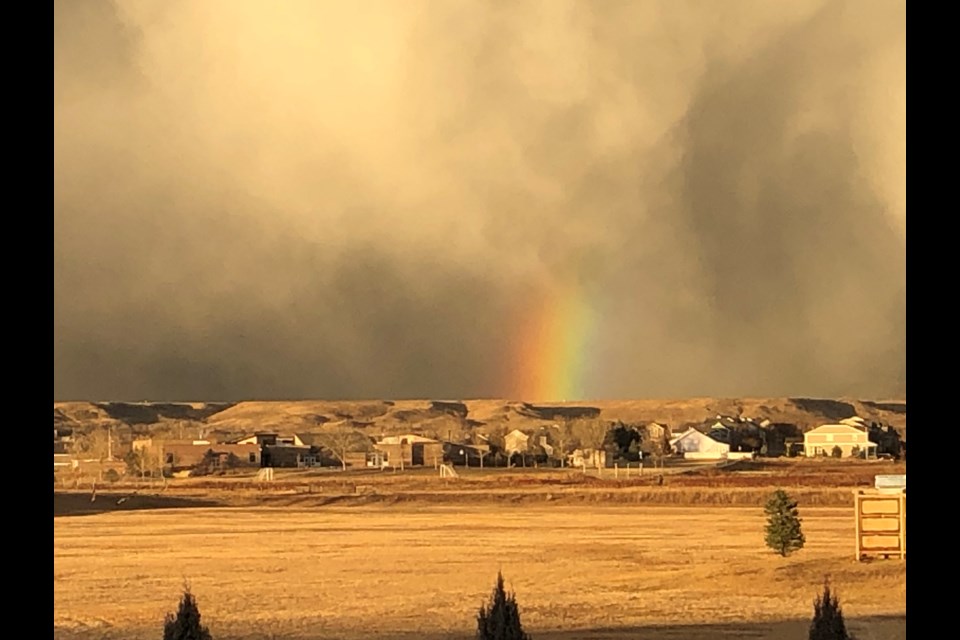 A rainbow appears as the wind storm approaches