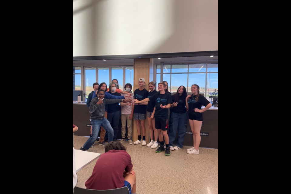 Westview Middle School team 2 and Sunset Middle School team 1 pose for photos after tying for first place at the St. Vrain Geography Bee on Thursday at the Innovation Center.