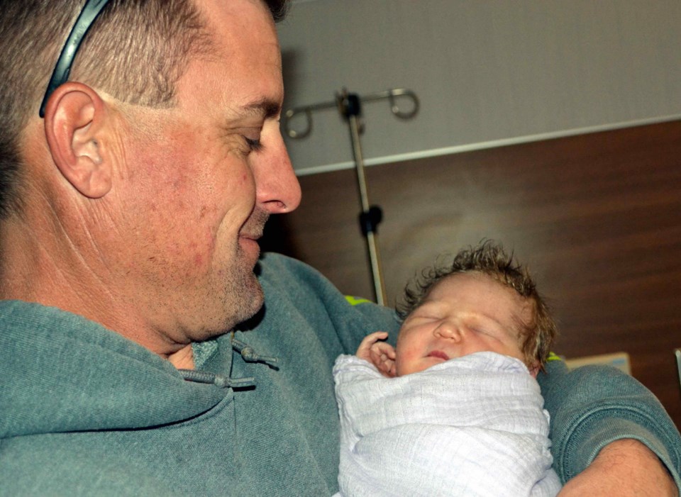 Jason Falstrom, a lifelong Longmont resident, smiles at his newborn baby girl, Lily. On Nov. 2, she was the 100th baby to be born at UCHealth Longs Peak Hospital in Longmont. 