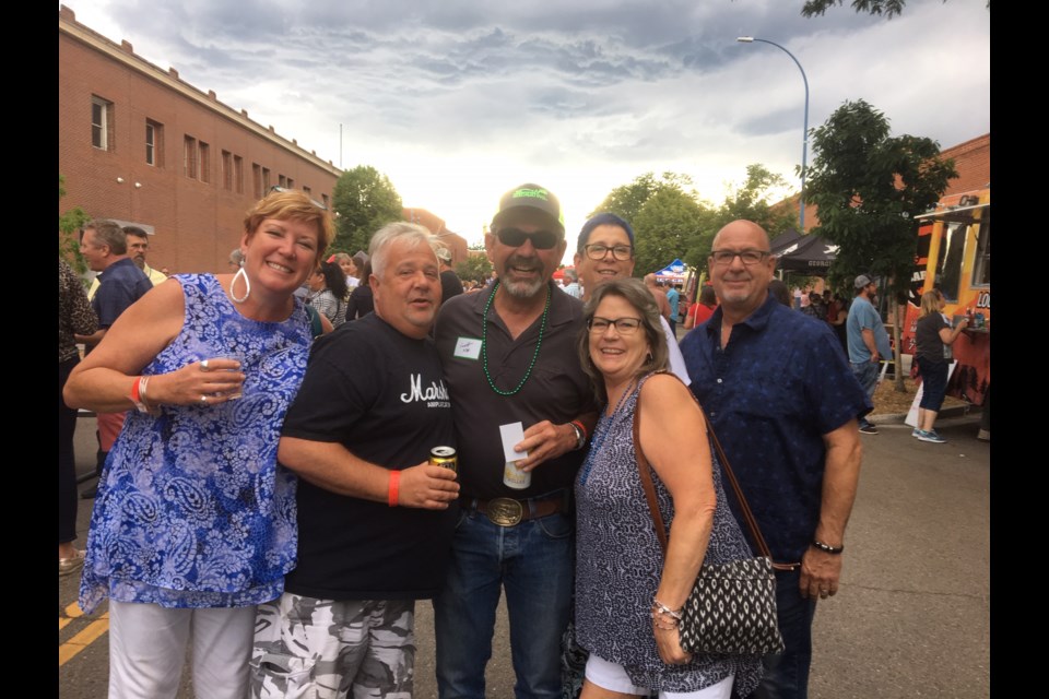SVVSD All Class Reunion. Scott Nix, who brought the all class reunion to the summer concert, unites with high school friends. (Photo by Macie May/Longmont Observer)