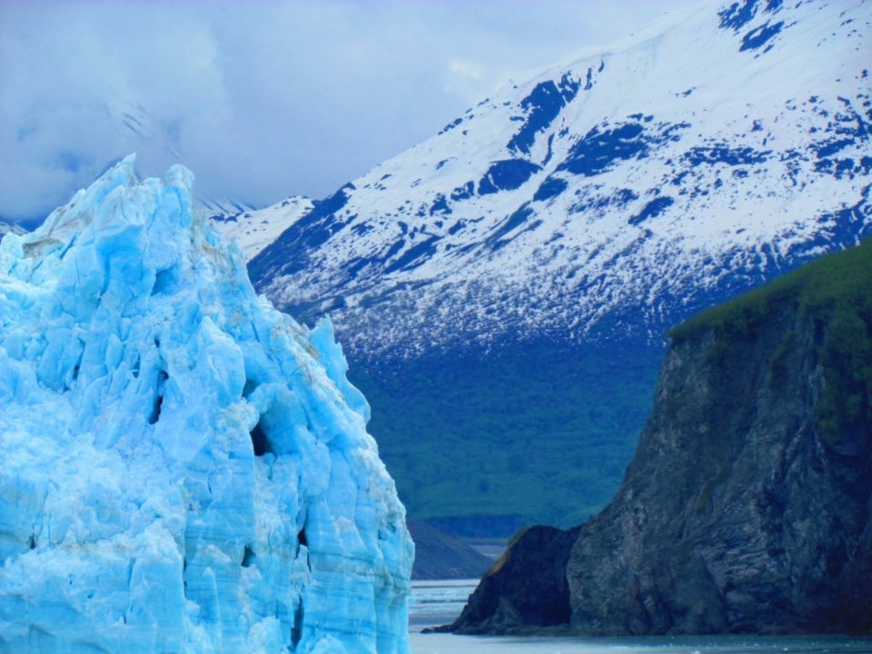 The crags of the Hubbard Glacier. The sheer ruggedness of it often causes tiny avalanches. This is called calving and results in layers of ice falling into the sea. Photo by Teri Beaver.