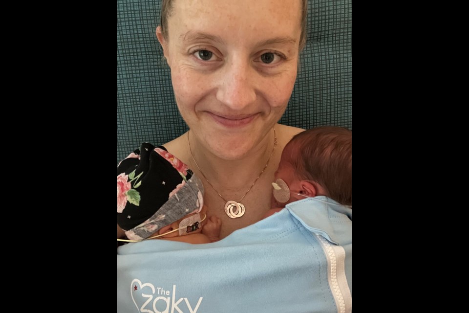 Tara Shaklee delivered her twin daughters, Indie Lou and Scottie Rae, after undergoing two in-utero surgeries to save their lives.