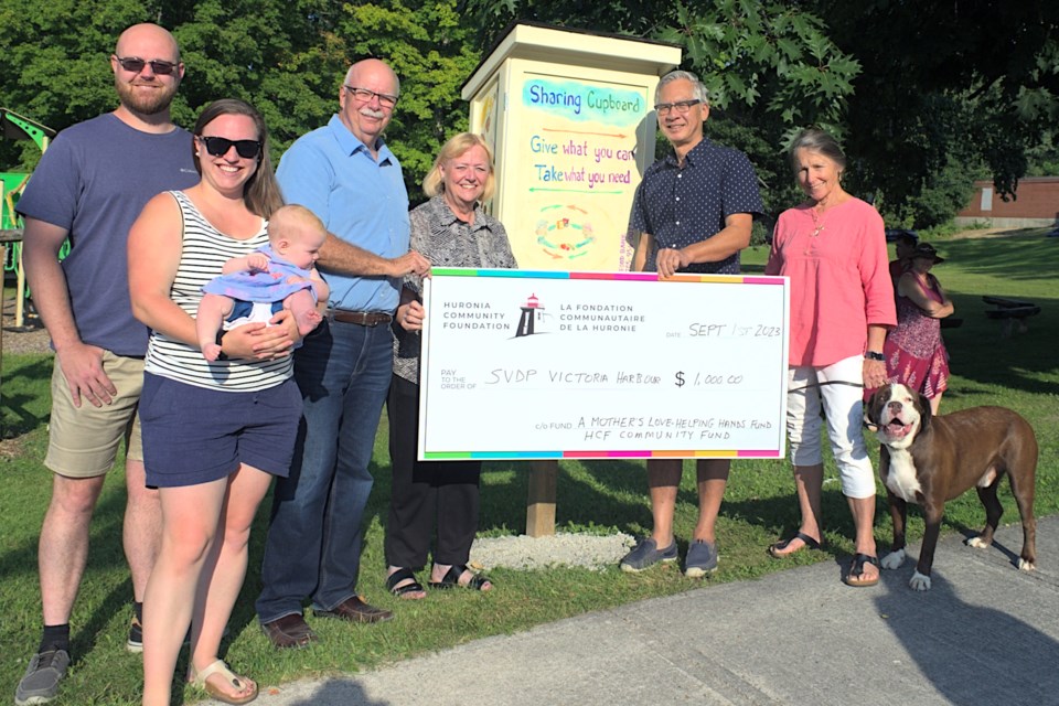 Donations from across Tay Township helped the three community cupboards get started, including a donation from HCF Smart and Caring, through A Mother’s Love - Helping Hands Fund established by Barb Jones. From left to right: Robert and Charlotte Hall with baby Annaleigh representing their mother Barb Jones; HCF executive director Scott Warnock; Cate Root; Ken Lung; and Lorna Tomlinson.