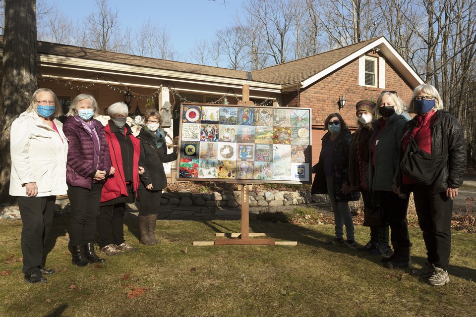 Members of the Tiny Women's Art Cooperative gathered in person to see the completed 'COVID 2020' art project before the Christmas holiday season. From left to right: Gerit Taeger, Gisèle Marchand-Maurice, Anne Armstrong, Cynthia Mills, Denise Baker, Halyna Mordowanec Regenbogen, Suzanne Rose, and Patsy Lalonde.
