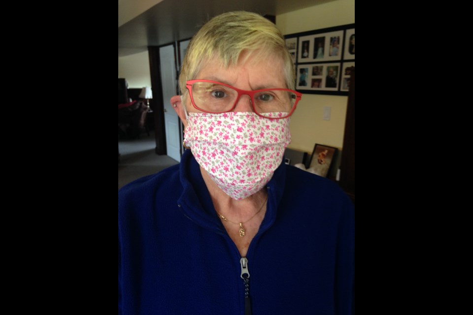 Donna Thompson wears one of the masks she's made for the cause. Submitted photo.