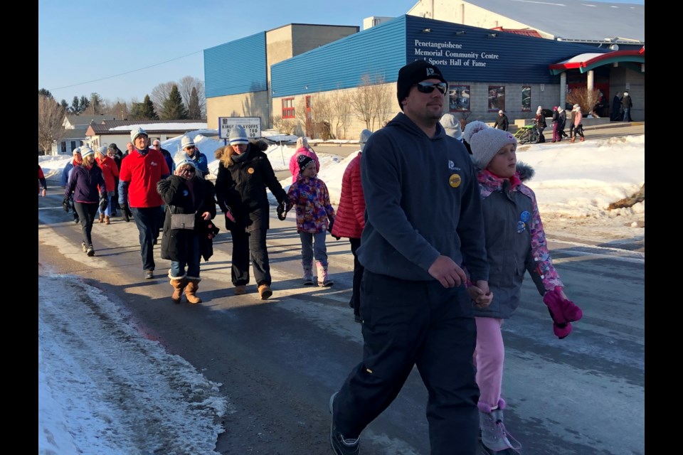 Participants leave from the Penetanguishene Arena to walk in Saturday’s Coldest Night of the Year fundraiser. Josée Philips/MidlandToday
