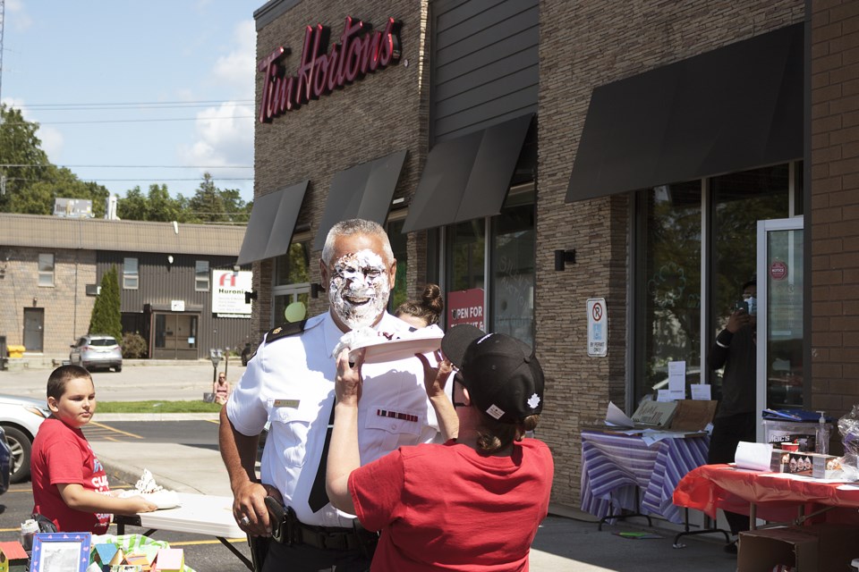 Franchise owners Brian and Joanne Smith donated $2,500 to Tim Hortons Foundation Camps, upon Southern Georgian Bay detachment commander Joseph Evans taking a pie to the face. Evans said, “I’m happy to do this for the kids.”