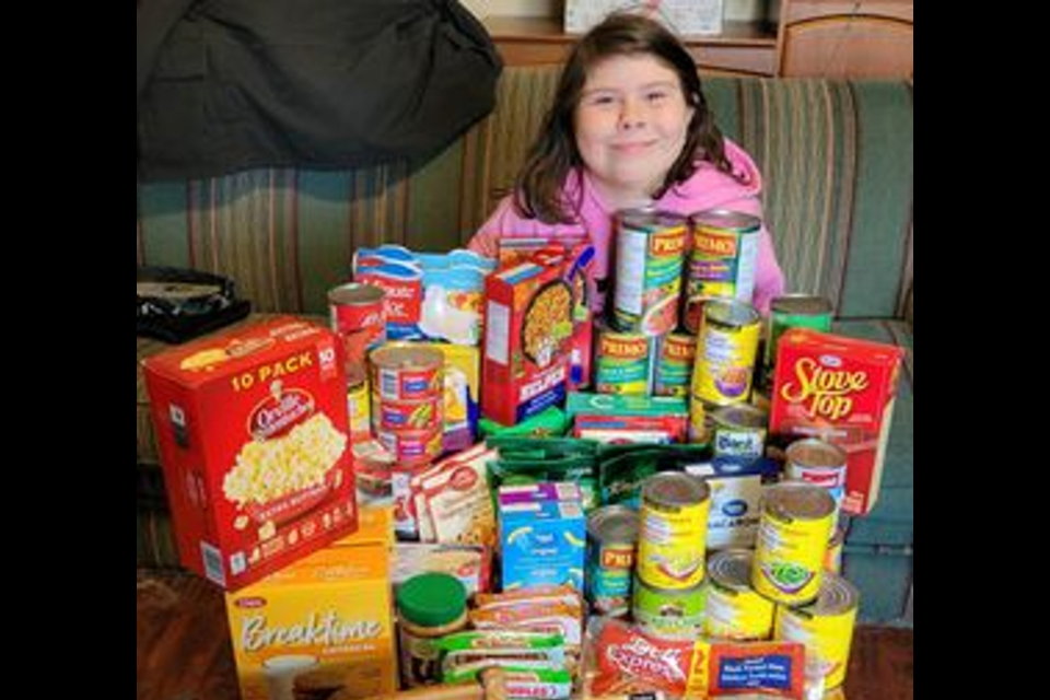 Lily-Lynn Beauchamp with the items she collected for The Guesthouse Shelter.