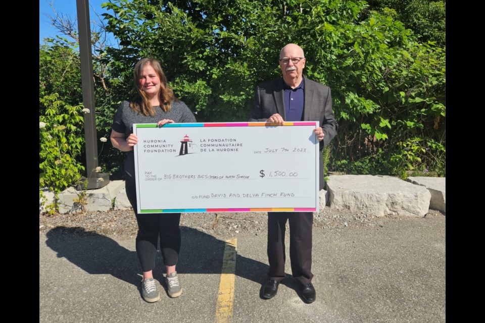 Haylie Taylor, fundraising and community development co-ordinator with Big Brothers Big Sisters of North Simcoe, is shown with Scott Warnock, executive director of the Huronia Community Foundation.