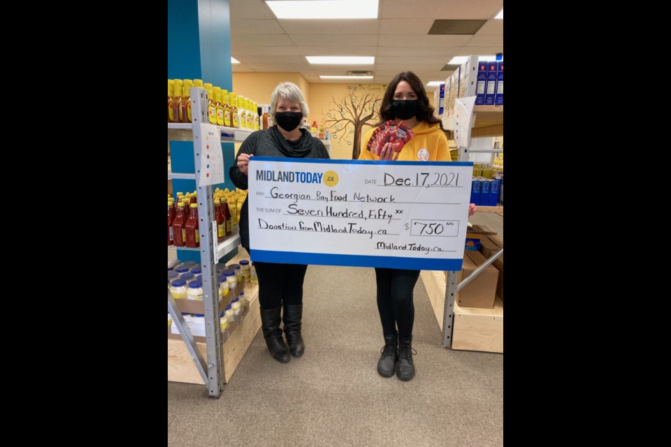 Barb from MidlandToday delivers a cheque to Alexandria Hamelin from the Georgian Bay Food Network just in time for the holidays.