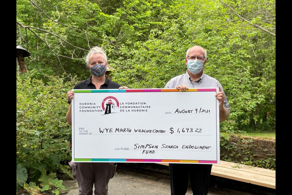 For several years, the Simpson Szarga Endowment Fund at the Huronia Community Foundation has provided financial support to the Wye Marsh Wildlife Centre. Pictured are Wye Marsh executive director Kim Hacker and Scott Warnock, HCF executive director.