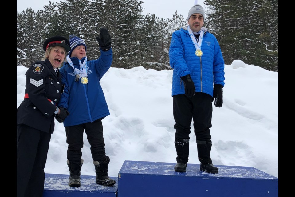 At the winter Special Olympics in 2019, Trevor Knight. centre, won three medals for Nordic skiing — two silver and a gold.