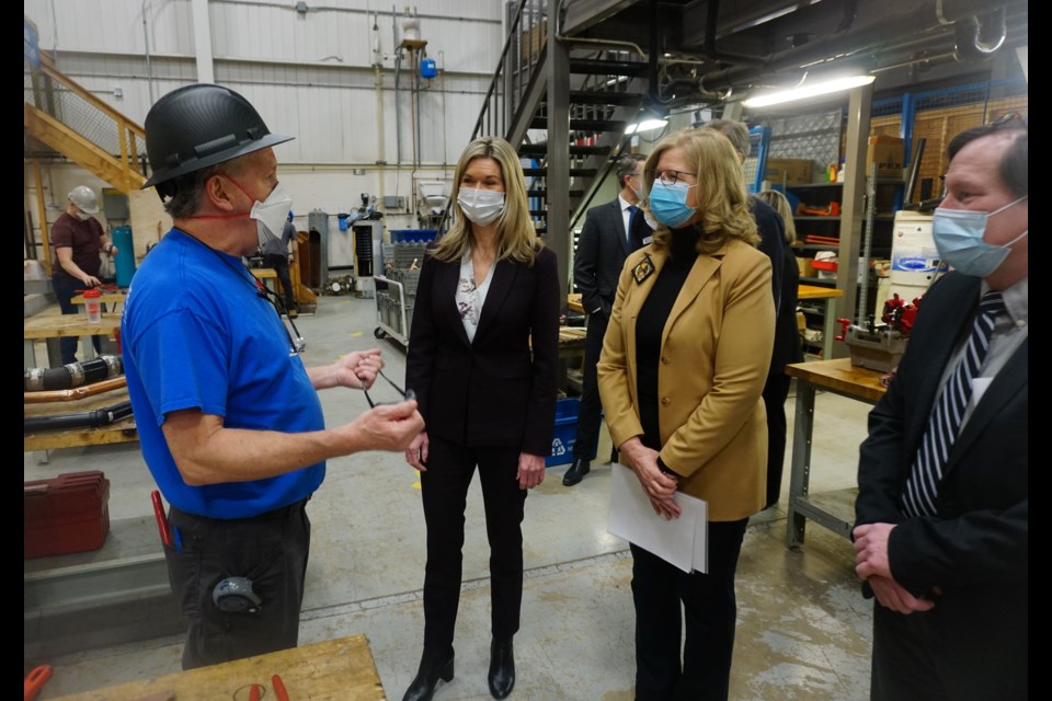 Ontario cabinet minister Jill Dunlop (second from left), Georgian College president MaryLynn West-Moynes and Georgian's Midland campus principal Mac Greaves chat with a teacher at the the Midland campus Wednesday.