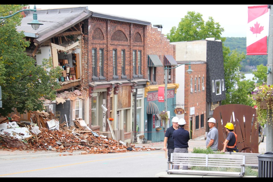 A portion of a historic building at 78 Main St., in downtown Penetanguishene, collapsed before dawn Thursday, displacing 14 people, none of whom were injured.