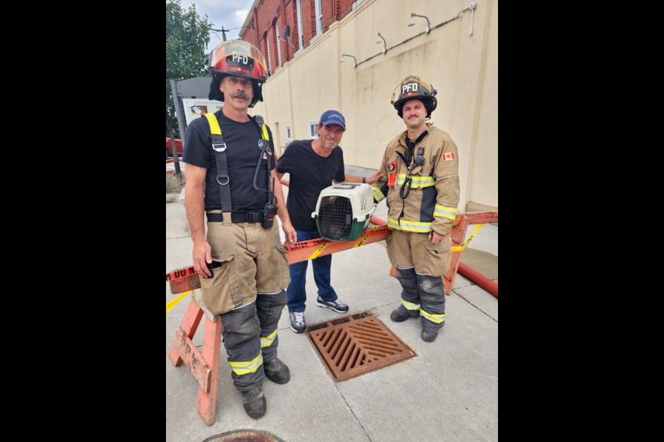 Midland/Penetanguishene firefighters were able to get two cats out of the partially collapsed 78 Main St. building and return them to their grateful owner.