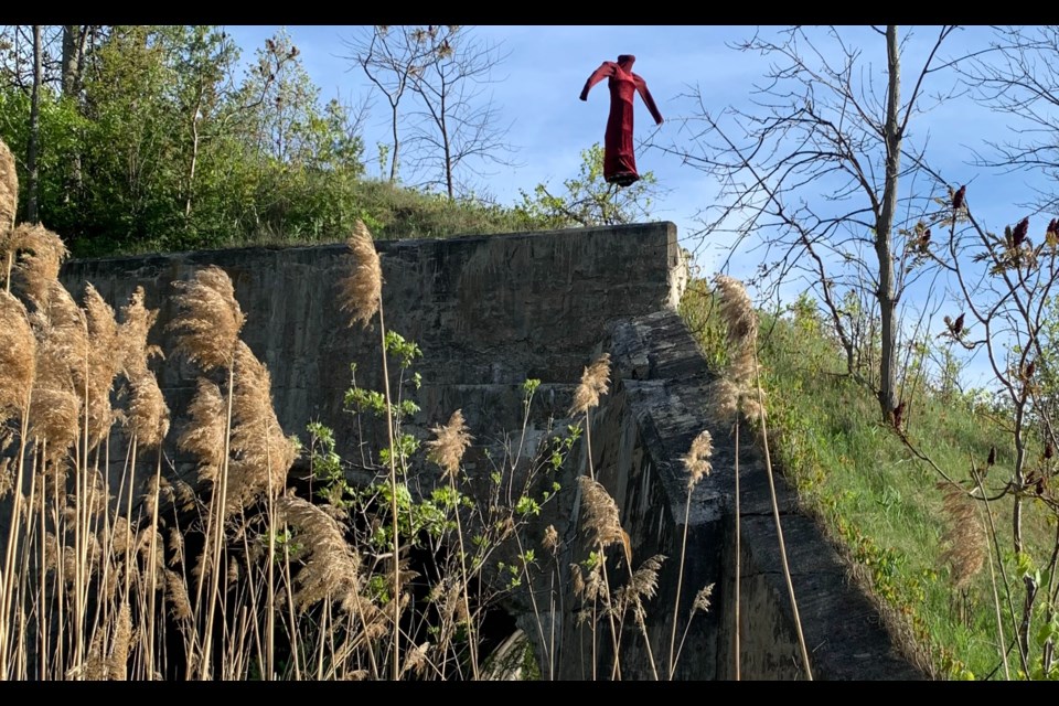 Monika Rekola hung a blood-red dress at the top of the iconic ‘hole in the wall’ structure located just off Highway 12 between Triple Bay and Reeves roads.