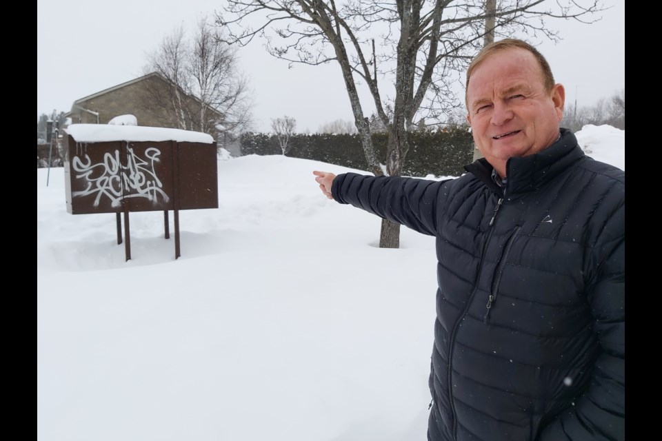 Coun. Brian Cummings has requested staff to bring forth a report on a new graffiti bylaw. He is pictured here in front of tagged Canada Post mailboxes on Beck Boulevard. Mehreen Shahid/MidlandToday