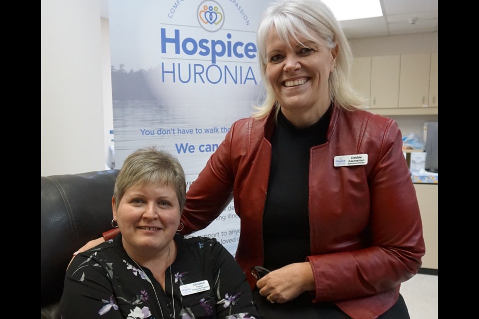 Christine Preston, left, and Debbie Kesheshian are pictured at Hospice Huronia's Penetanguishene office. Andrew Philips/MidlandToday