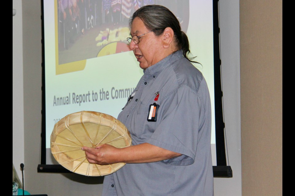 Waypoint employee Austin Mixemong opens the Annual Report to the Community on Friday with a drum song.