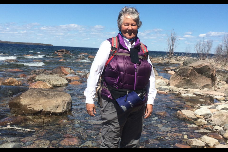 After more than 35 years hiking, Frieda Baldwin has lost track of how many kilometers she has hiked. Now, she tracks her hikes by the hour. Baldwin is pictured here leading a hike at Awenda.