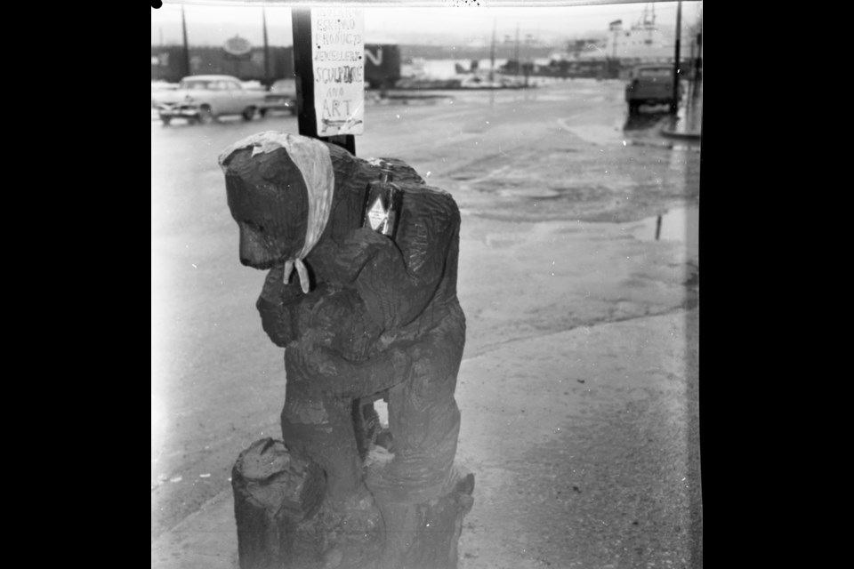Bear Carving on King at Bay Street Midland.  Free Press Archive Huronia Museum.