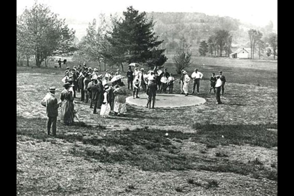 Golfers gather around the first hole at the Midland Golf and Country Club, which at the time only had nine holes and was invite-only. Today, the club is public.