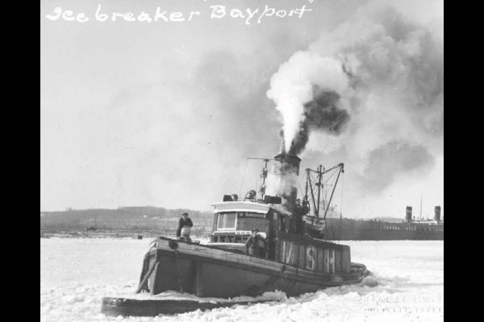 The Bayport tugboat pictured here from this photo taken in 1952 features a special bow designed by Captain Edward Francis Burke from the Georgian Bay area.
