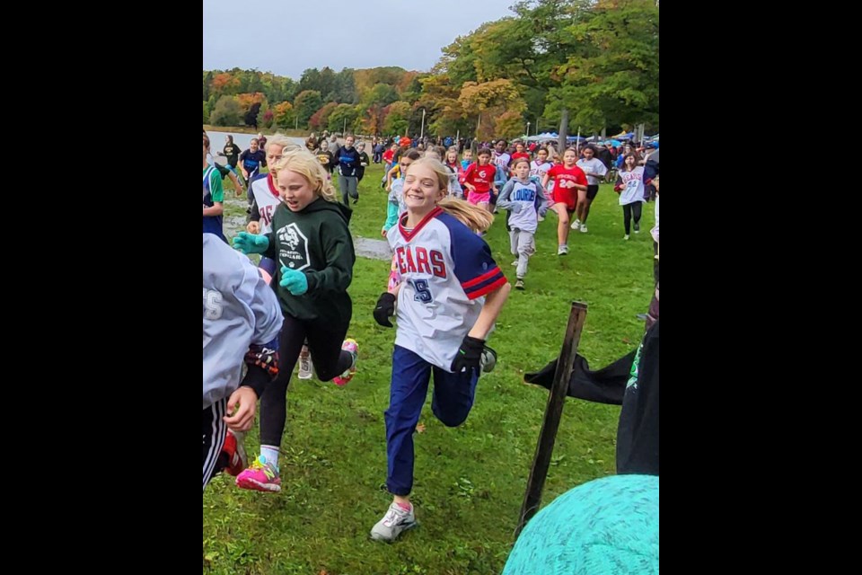 Eleven-year-old Grace Desjardins loves running so much she beams while participating in a cross-country meet representing Bayview Public School. 