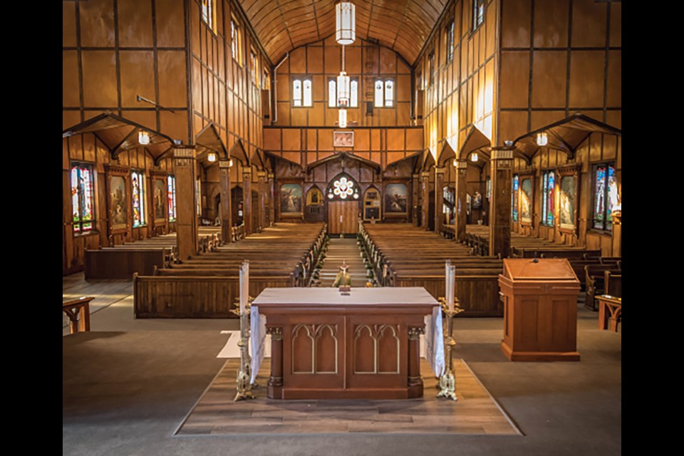 This view from the inside of the Church of St. Joseph at Martyr’s Shrine offers a glimpse of the two features built into the church to pay respect to the indigenous people — the vaulted canoe-shaped ceiling, and the long-house inspired church.