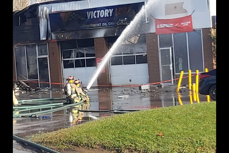 Firefighters work to contain the blaze.