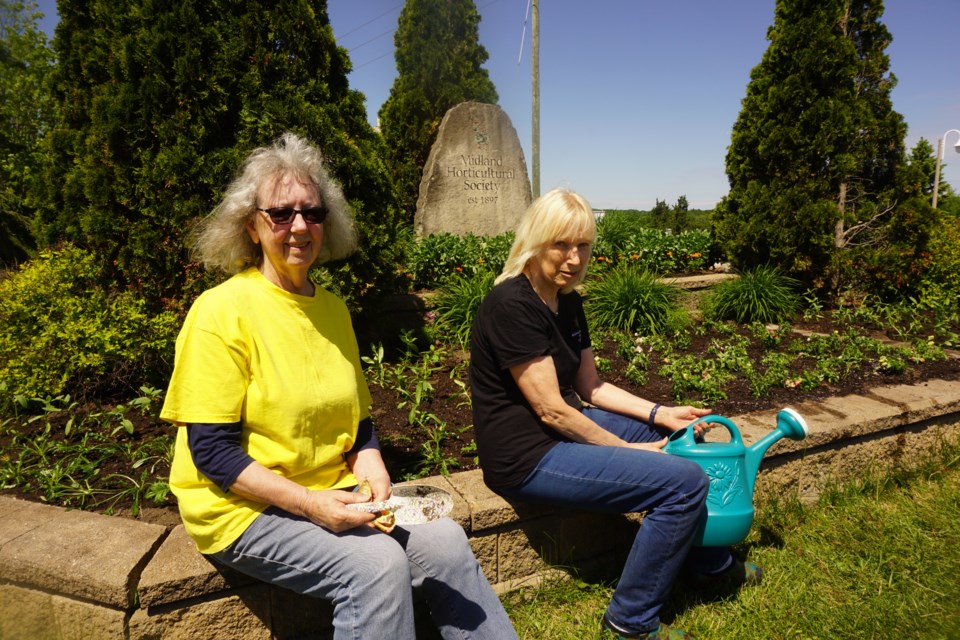 Jenni McKeown, left, and Liz Schandlen say they enjoy being part of the club, which began in 1897.                    