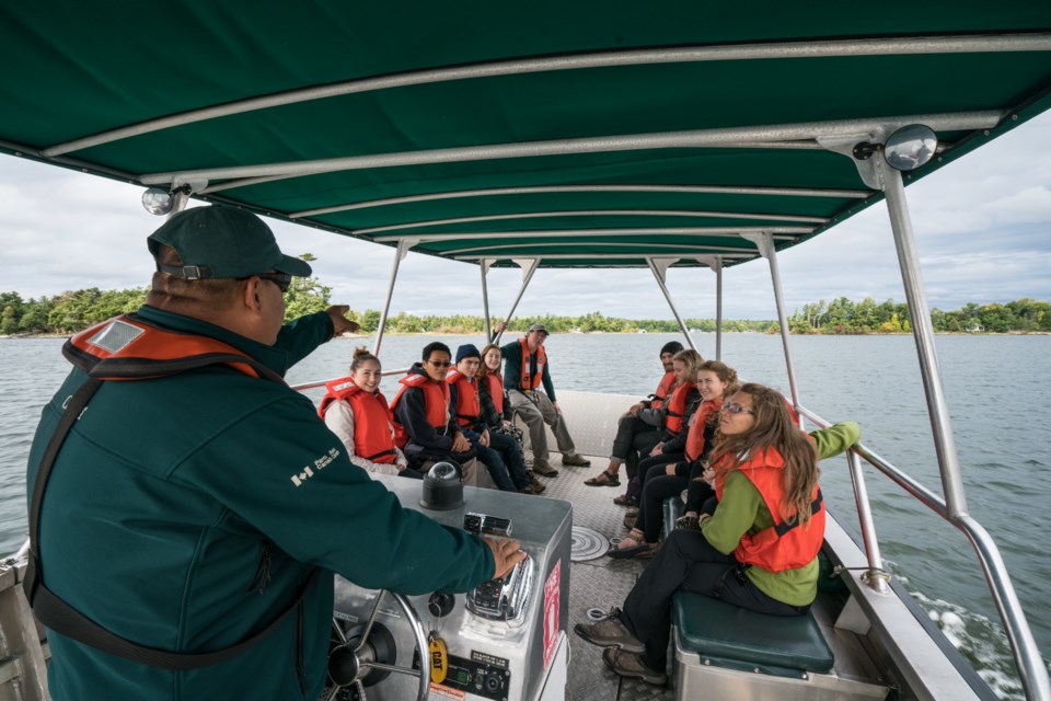 Campus Club students are seen riding the Parks Canada Day Tripper Shuttle to Georgian Bay Islands National Park in the fall.