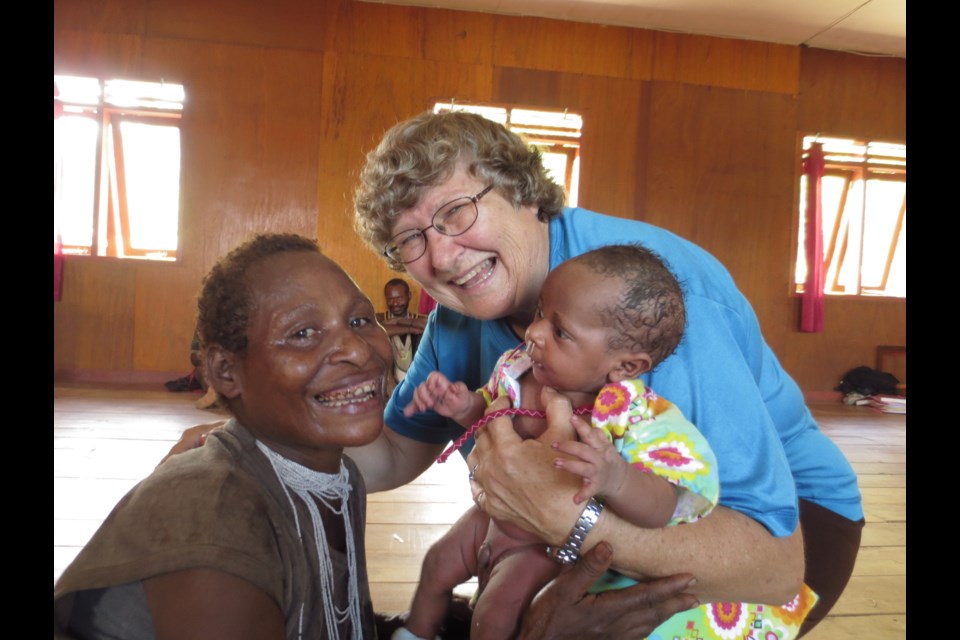 One of many healthy babies that Lois Belsey helped bring into the world while working as a nurse and midwife in a village “smack dab” in the middle of Papua, Indonesia. 