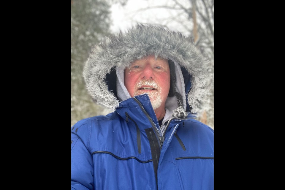 Regardless of the weather, Ross Newhook walks seven kilometres each day from Wymbolwood Beach to Balm Beach.