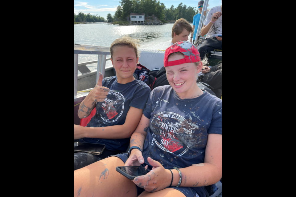 Taylor McCoubrey and Quinlan Laverdiere enjoying a sunny ride after a long day of painting with Painters on the Bay — a Student Works painting company started by local young businessperson Hailey McCoubrey.