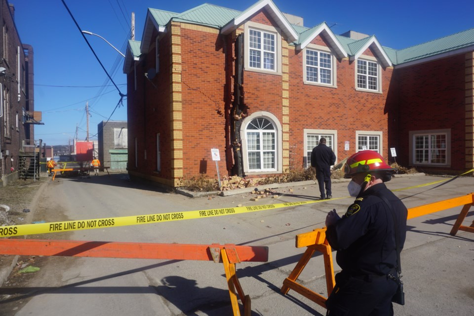                   Police attended the scene at the northeast corner of Hugel Avenue at Borsa Lane after a recycling truck struck a building on Friday, March 12, 2021.
