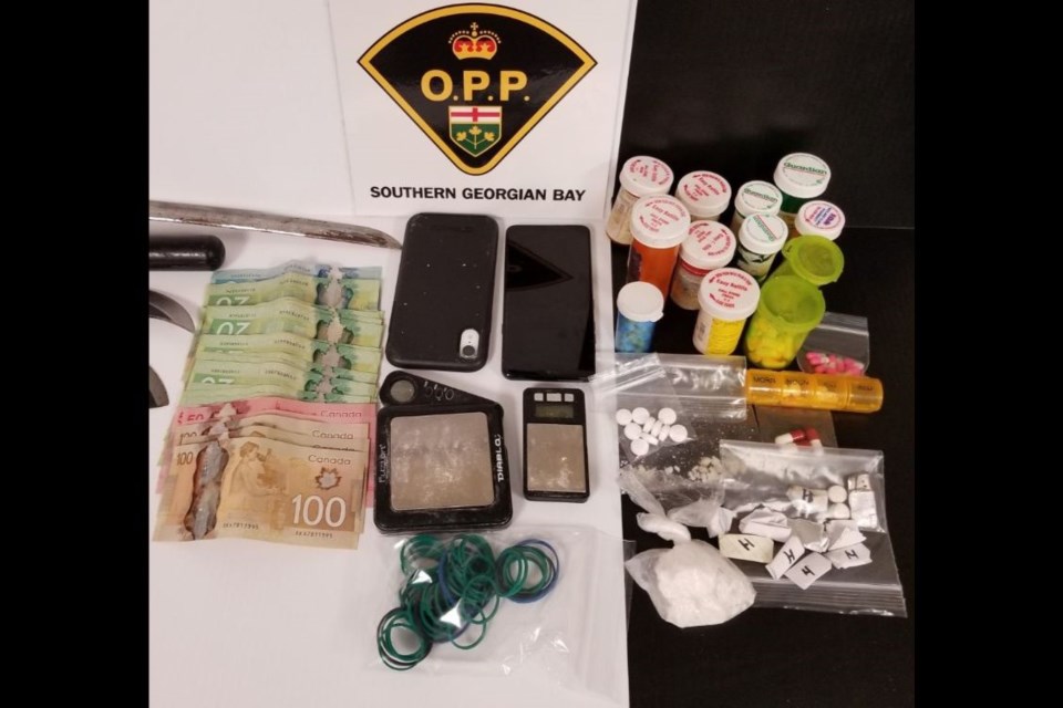 Police seized suspected drugs and cash as part of the execution of a search warrant at a Midland motel on Sept. 14, 2021.