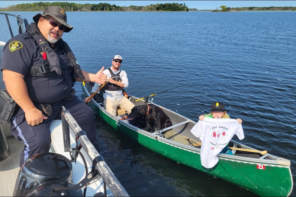 People who were 'caught' wearing their life-jackets during the Labour Day long weekend were rewarded with a T-shirt from Southern Georgian Bay OPP.