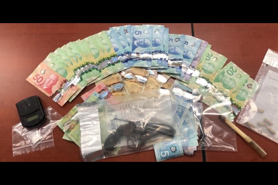 A quantity of cash and cocaine was seized during a traffic stop Saturday night on Yonge Street. OPP Photo