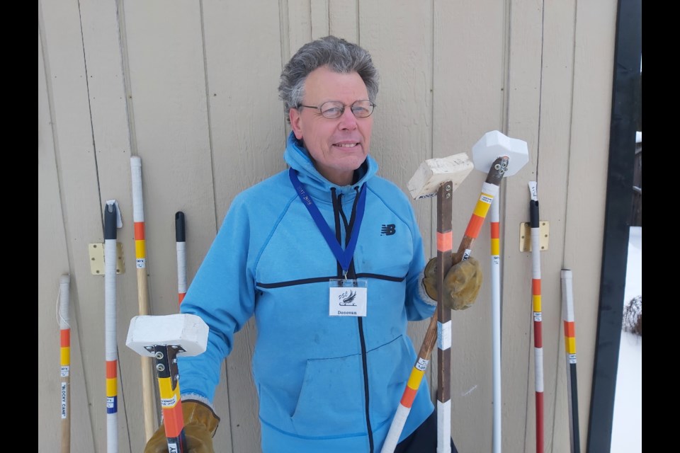 Donavon Quackenbush is pictured with some of his Block Hockey sticks outside his Midland home.