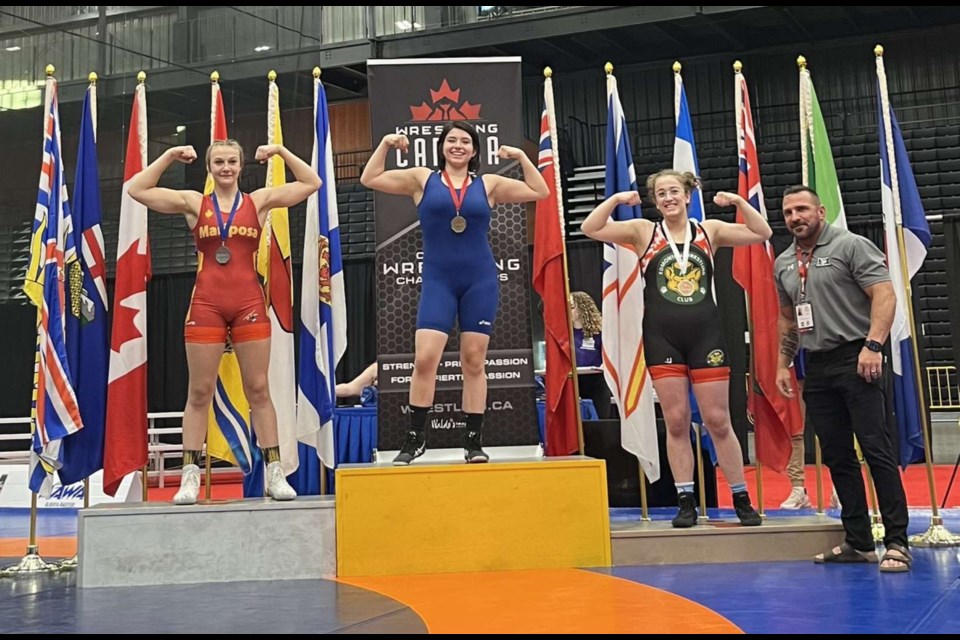 After placing second overall at the National Wrestling Championships in Calgary, Lauren Smith (left) met her hero Canadian Olympic Gold medallist Erica Wiebe who told her to keep wrestling.