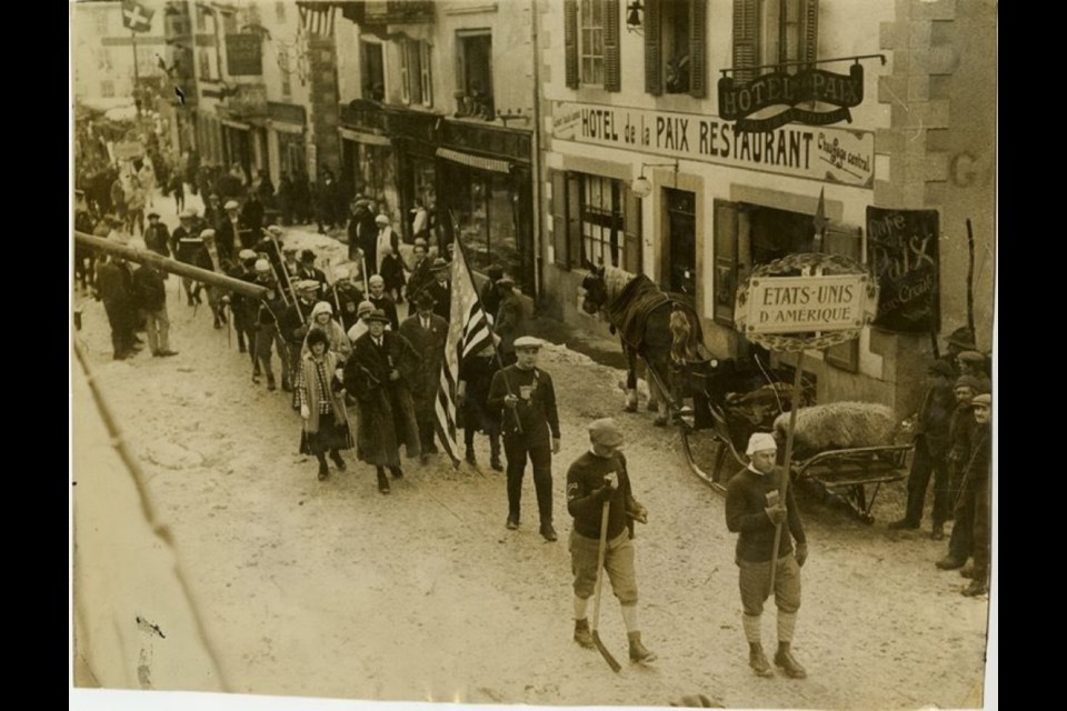 Herb Drury leading the American Olympic team in the parade of athletes through the streets of Chamonix en route to the Opening Ceremonies.