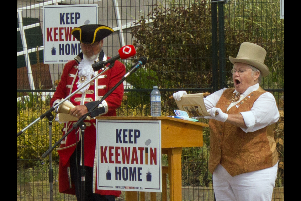 Keep Keewatin Home Cry is delivered by Judy Contin (Midland's Town Crier) and Steve Travers (Barrie's Town Crier). 