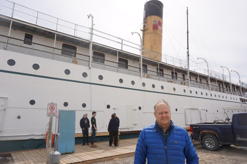 Doug Cowie, manager of the Marine Museum of the Great Lakes, stands in front of the SS Keewatin during visit Tuesday.  